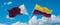 two crossed flags Colombia and Qatar waving in wind at cloudy sky. Concept of relationship, dialog, travelling between two