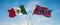 two crossed flags confederate battle or Dixie flag and mexico waving in wind at cloudy sky. Concept of relationship, dialog,