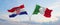 two crossed flags Croatia and Italy waving in wind at cloudy sky. Concept of relationship, dialog, travelling between two