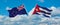 two crossed flags Cuba and New Zealand waving in wind at cloudy sky. Concept of relationship, dialog, travelling between two