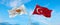 two crossed flags Cyprus and Turkey waving in wind at cloudy sky. Concept of relationship, dialog, travelling between two