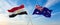 two crossed flags Egypt and Australia waving in wind at cloudy sky. Concept of relationship, dialog, travelling between two