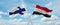 two crossed flags Egypt and finland waving in wind at cloudy sky. Concept of relationship, dialog, travelling between two