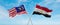 two crossed flags Egypt and Malaysia waving in wind at cloudy sky. Concept of relationship, dialog, travelling between two