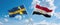 two crossed flags Egypt and Sweden waving in wind at cloudy sky. Concept of relationship, dialog, travelling between two countries