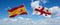 two crossed flags Georgia and spain waving in wind at cloudy sky. Concept of relationship, dialog, travelling between two