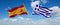 two crossed flags Greece and spain waving in wind at cloudy sky. Concept of relationship, dialog, travelling between two countries