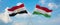 two crossed flags Hungary and Egypt waving in wind at cloudy sky. Concept of relationship, dialog, travelling between two