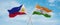 two crossed flags India and Philippines waving in wind at cloudy sky. Concept of relationship, dialog, travelling between two
