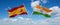 two crossed flags India and spain waving in wind at cloudy sky. Concept of relationship, dialog, travelling between two countries