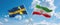 two crossed flags Iran and Sweden waving in wind at cloudy sky. Concept of relationship, dialog, travelling between two countries