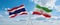 two crossed flags Iran and Thailand waving in wind at cloudy sky. Concept of relationship, dialog, travelling between two