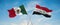 two crossed flags Iraq and mexico waving in wind at cloudy sky. Concept of relationship, dialog, travelling between two countries