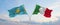 two crossed flags Kazakhstan and Italy waving in wind at cloudy sky. Concept of relationship, dialog, travelling between two