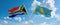 two crossed flags Kazakhstan and South Africa waving in wind at cloudy sky. Concept of relationship, dialog, travelling between