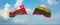 two crossed flags LITHUANIA and Oman waving in wind at cloudy sky. Concept of relationship, dialog, travelling between two