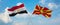 two crossed flags Macedonia and Egypt waving in wind at cloudy sky. Concept of relationship, dialog, travelling between two