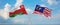 two crossed flags Malaysia and Oman waving in wind at cloudy sky. Concept of relationship, dialog, travelling between two