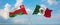 two crossed flags Mexico and Oman waving in wind at cloudy sky. Concept of relationship, dialog, travelling between two countries