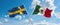 two crossed flags Mexico and Sweden waving in wind at cloudy sky. Concept of relationship, dialog, travelling between two