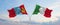 two crossed flags Mongolia and Italy waving in wind at cloudy sky. Concept of relationship, dialog, travelling between two