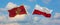 two crossed flags Montenegro and Poland waving in wind at cloudy sky. Concept of relationship, dialog, travelling between two