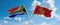 two crossed flags Montenegro and South Africa waving in wind at cloudy sky. Concept of relationship, dialog, travelling between