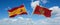 two crossed flags Montenegro and spain waving in wind at cloudy sky. Concept of relationship, dialog, travelling between two