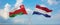 two crossed flags netherlands and Oman waving in wind at cloudy sky. Concept of relationship, dialog, travelling between two