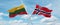 two crossed flags Norway and Lithuania waving in wind at cloudy sky. Concept of relationship, dialog, travelling between two