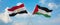 two crossed flags Palestine and Egypt waving in wind at cloudy sky. Concept of relationship, dialog, travelling between two