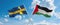 two crossed flags Palestine and Sweden waving in wind at cloudy sky. Concept of relationship, dialog, travelling between two