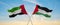 two crossed flags Palestine and United Arab Emirates waving in wind at cloudy sky. Concept of relationship, dialog, travelling