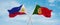 two crossed flags portugal and Philippines waving in wind at cloudy sky. Concept of relationship, dialog, travelling between two