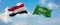 two crossed flags Saudi Arabia and Egypt waving in wind at cloudy sky. Concept of relationship, dialog, travelling between two