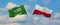 two crossed flags Saudi Arabia and Poland waving in wind at cloudy sky. Concept of relationship, dialog, travelling between two