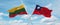 two crossed flags Taiwan and Lithuania waving in wind at cloudy sky. Concept of relationship, dialog, travelling between two