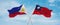 two crossed flags Taiwan and Philippines waving in wind at cloudy sky. Concept of relationship, dialog, travelling between two