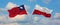 two crossed flags Taiwan and Poland waving in wind at cloudy sky. Concept of relationship, dialog, travelling between two