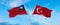 two crossed flags Taiwan and Turkey waving in wind at cloudy sky. Concept of relationship, dialog, travelling between two