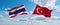 two crossed flags Turkey and Thailand waving in wind at cloudy sky. Concept of relationship, dialog, travelling between two