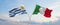 two crossed flags Uruguay and Italy waving in wind at cloudy sky. Concept of relationship, dialog, travelling between two