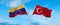 two crossed flags Venezuela and Turkey waving in wind at cloudy sky. Concept of relationship, dialog, travelling between two