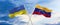 two crossed flags Venezuela and Ukraine waving in wind at cloudy sky. Concept of relationship, dialog, travelling between two