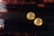 Two cryptocurrency bitcoin on Exposed and Developed old film negative strips background.
