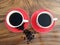 Two cups of black morning coffee and raw coffee beans top view, high angle view. Fresh morning coffee drink concept. Copy space.