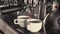 Two cups of coffee being poured from a professional espresso machine. Close-Up. Concept of coffee making, service