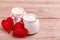 Two cups of coffee with decorative felt heart on wooden background close-up. The Concept Of Valentine`s Day, Christmas