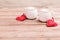 Two cups of coffee with decorative felt heart on wooden background close-up. The Concept Of Valentine`s Day, Christmas