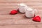 Two cups of coffee with decorative felt heart on wooden background close-up. The Concept Of Valentine`s Day, Christmas